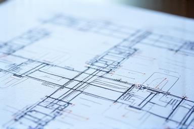 Photo of blueprints and connection diagrams for grid tie-in